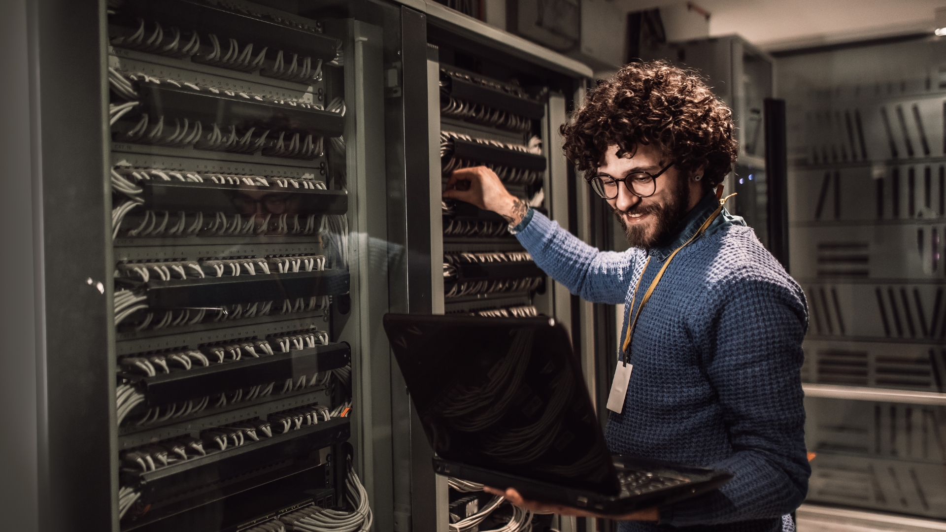 Pop Box engineer working on network cabling