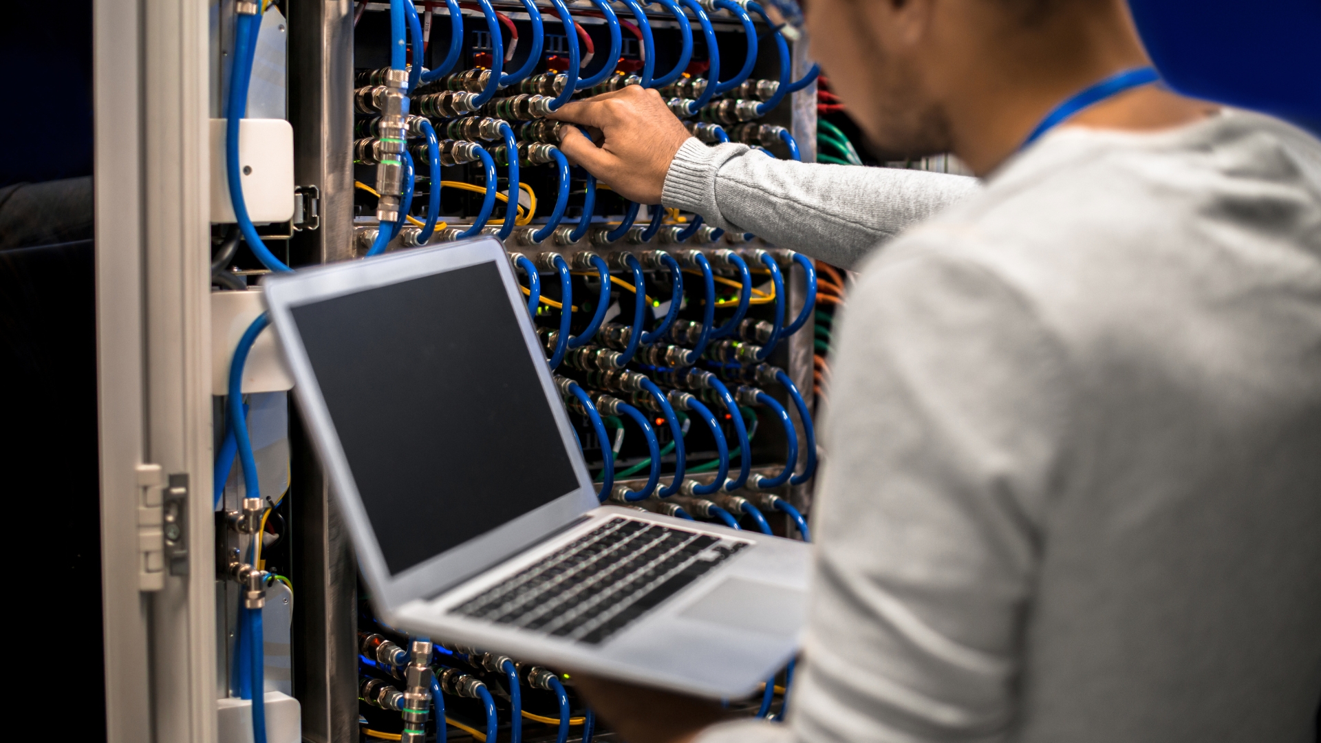 Engineer fixing cables