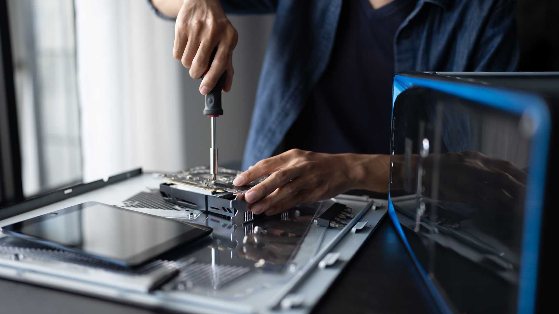 Pop Box engineer servicing a hard drive